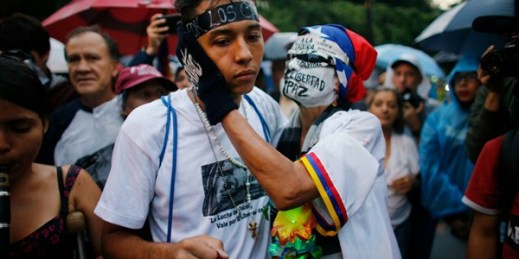 People embrace during a vigil to honor those killed during anti-government protests, Caracas, Venezuela, July 13, 2017 (AP photo by Ariana Cubillos).
