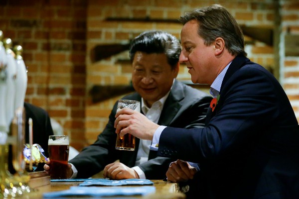 Britain's then-Prime Minister David Cameron and Chinese President Xi Jinping at The Plough pub, Casden, England, Oct. 22, 2015 (AP Photo by Kirsty Wigglesworth).
