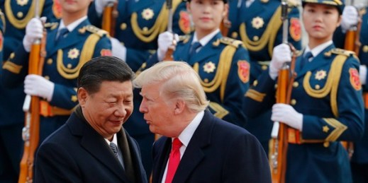 U.S. President Donald Trump chats with Chinese President Xi Jinping during a welcome ceremony at the Great Hall of the People, Beijing, Nov. 9, 2017 (AP photo by Andy Wong).