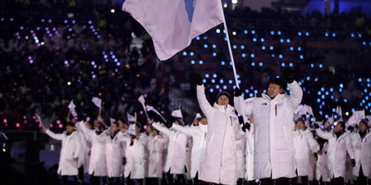 North Korea’s Hwang Chung Gum and South Korea’s Won Yun-jong carry the flag of Korean unification during the opening ceremony of the 2018 Winter Olympics in Pyeongchang, South Korea, Feb. 9, 2018 (AP photo by Vadim Ghirda).