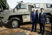 Australian Prime Minister Malcolm Turnbull and Japanese counterpart Shinzo Abe stand in front of an Australian-built Bushmaster Protected Mobility Vehicle, Funabashi, Japan, Jan. 18, 2018 (AP photo by Eugene Hoshiko).