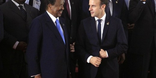 Cameroonian President Paul Biya speaks with French President Emmanuel Macron during an EU Africa summit in Abidjan, Cote d'Ivoire, Nov. 29, 2017 (AP photo by Diomande Ble Blonde).