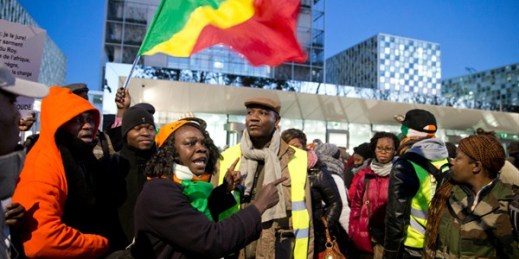 Supporters of Cote d’Ivoire’s former president, Laurent Gbagbo, and former youth minister, Charles Ble Goude, rally outside the International Criminal Court, The Hague, Netherlands, Jan. 28, 2016 (AP photo by Peter Dejong).