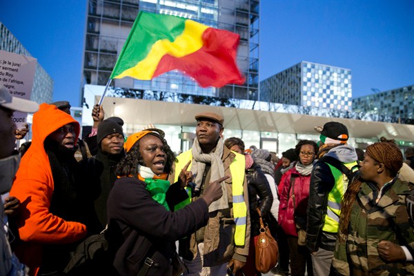 Supporters of Cote d’Ivoire’s former president, Laurent Gbagbo, and former youth minister, Charles Ble Goude, rally outside the International Criminal Court, The Hague, Netherlands, Jan. 28, 2016 (AP photo by Peter Dejong).