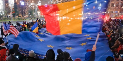 Romanians hold a large European Union flag during a protest in Bucharest, Romania, Dec. 3, 2017 (AP photo by Vadim Ghirda).