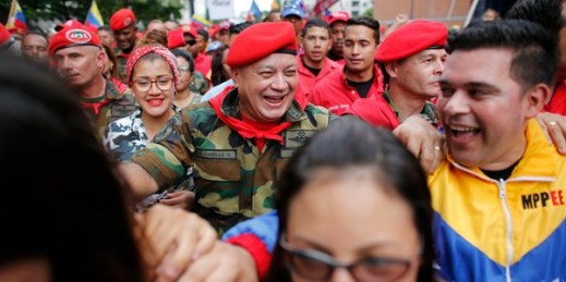 Diosdado Cabello, center, the chief of Venezuela’s ruling party, attends a parade marking the anniversary of a 1992 failed coup, Feb. 4, 2018 (AP photo by Ariana Cubillos).