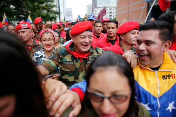 Diosdado Cabello, center, the chief of Venezuela’s ruling party, attends a parade marking the anniversary of a 1992 failed coup, Feb. 4, 2018 (AP photo by Ariana Cubillos).