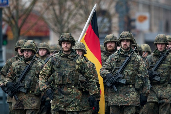 Soldiers in the German Army attend a military parade ceremony marking the 99th anniversary of the Lithuanian military on Armed Forces Day, Vilnius, Lithuania, Nov. 24, 2017 (AP photo by Mindaugas Kulbis).