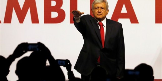 Andres Manuel Lopez Obrador holds his hand out to take an oath as he is named the presidential candidate for the Morena political party, Mexico City, Feb. 18, 2018 (AP photo by Eduardo Verdugo).