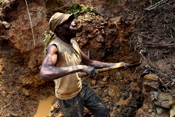 A Congolese miner digs for cassiterite, the major ore of tin, at Nyabibwe mine, Democratic Republic of Congo, Aug. 17, 2012 (AP photo by Marc Hofer).