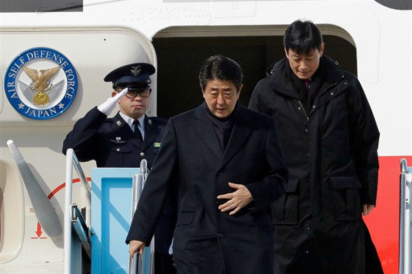 Japanese Prime Minister Shinzo Abe arrives for the 2018 Winter Olympics at Yangyang International Airport, Yangyang, South Korea, Feb. 9, 2018 (AP photo by Lee Jin-man).