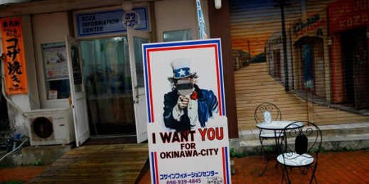 A cutout board of Uncle Sam is posted outside an information center for tourists near Kadena Air Base, Okinawa, Japan, Dec. 1, 2012 (AP photo by Junji Kurokawa).