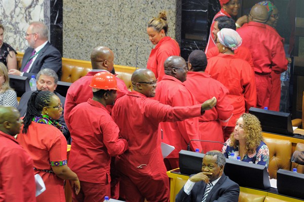 Members of South Africa’s opposition Economic Freedom Fighters party walk out of parlaiment in protest, Cape Town, South Africa, Feb 15, 2018 (AP photo by Rodger Bosch).