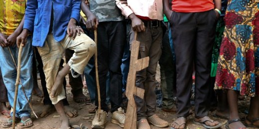 Former child soldiers stand in line for registration with UNICEF, Yambio, South Sudan, Feb. 7, 2018 (AP photo by Sam Mednick).