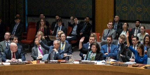 Russia’s ambassador to the U.N., Vassily Nebenzia, left, watches as the ambassadors of Sweden, the United Kingdom and the United States vote on a resolution at a Security Council meeting on Syria, April 14, 2018 (AP photo by Mary Altaffer).