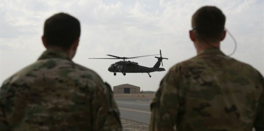 A UH-60 Black Hawk helicopter carrying U.S. advisers and Afghan trainees takes off at Kandahar Air Field, Afghanistan, March 19, 2018 (AP photo by Rahmat Gul).