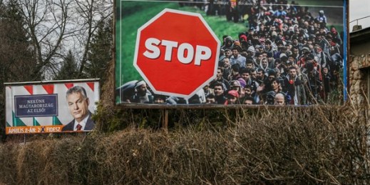 An election poster for Hungarian Prime Minister Viktor Orban is displayed on a roadside next to an official government anti-immigrant banner, Miskolc, Hungary, March 31, 2018 (Sipa photo by Michal Fludra via AP Images).