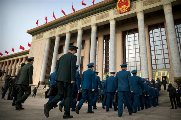 Military delegates arrive for the closing session of China’s National People’s Congress at the Great Hall of the People, Beijing, March 20, 2018 (AP photo by Mark Schiefelbein).