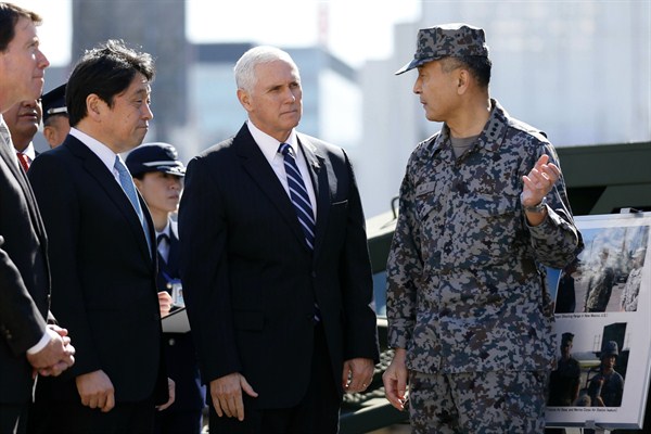 U.S. Vice President Mike Pence speaks with a Japanese officer as he inspects a PAC-3 interceptor missile system with Japanese Defense Minister Itsunori Onodera, Tokyo, Feb. 7, 2018 (AP photo by Toru Hanai).