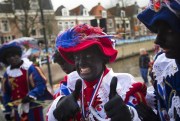 A man dressed up as Zwarte Piet during a celebration marking the arrival of Sinterklaas, or Saint Nicholas, in Dokkum, Netherlands, Nov. 18, 2017 (AP photo by Peter Dejong).