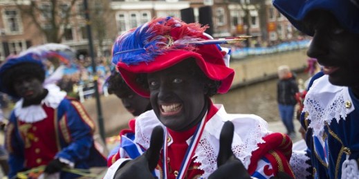 A man dressed up as Zwarte Piet during a celebration marking the arrival of Sinterklaas, or Saint Nicholas, in Dokkum, Netherlands, Nov. 18, 2017 (AP photo by Peter Dejong).