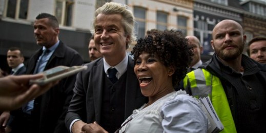 Dutch lawmaker Geert Wilders laughs with a supporter during a campaign stop in Heerlen, Netherlands, March 11, 2017 (AP photo by Muhammed Muheisen).