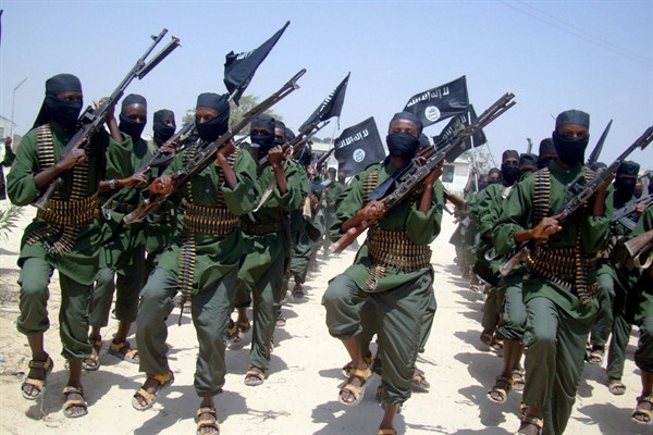 Al-Shabab fighters march with their weapons during military exercises on the outskirts of Mogadishu, Somalia, Feb. 17, 2011 (AP photo by Mohamed Sheikh Nor).