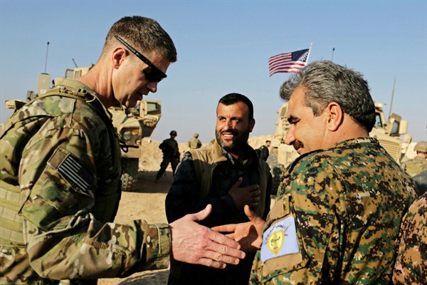 U.S. Army Maj. Gen. Jamie Jarrard thanks Manbij Military Council commander Muhammed Abu Adeel during a visit to a small outpost near the town of Manbij, Syria, Feb. 7, 2018 (AP photo by Susannah George).