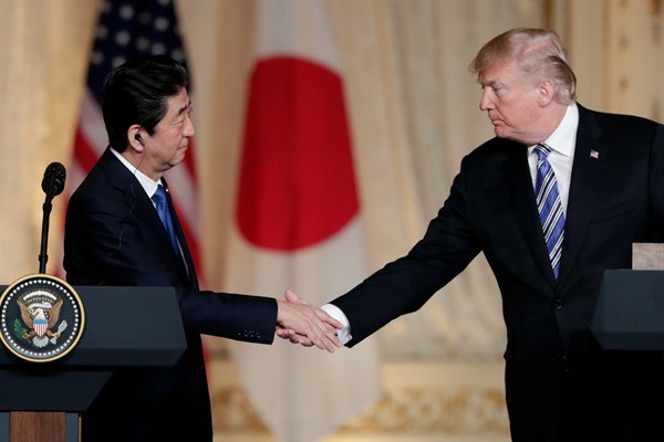 Japanese Prime Minister Shinzo Abe and U.S. President Donald Trump shake hands during a news conference at Mar-a-Lago, Palm Beach, Fla., April 18, 2018 (AP photo by Lynn Sladky).