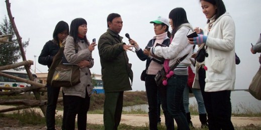 Citizen science volunteers interview a forest ranger about environmental threats to Xuan Thuy National Park, Vietnam, Undated (Photo courtesy of Do Hai Linh/Pan Nature).