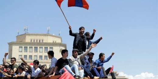 Supporters of newly installed Armenian Prime Minister Nikol Pashinyan stand on top of a vehicle as they protest in Republic Square, Yerevan, Armenia, May 2, 2018 (AP photo by Sergei Grits).