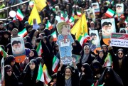 An Iranian girl holds up a caricature of U.S. President Donald Trump during a rally marking the 39th anniversary of the 1979 Islamic Revolution, Tehran, Iran, Feb. 11, 2018 (AP photo by Ebrahim Noroozi).