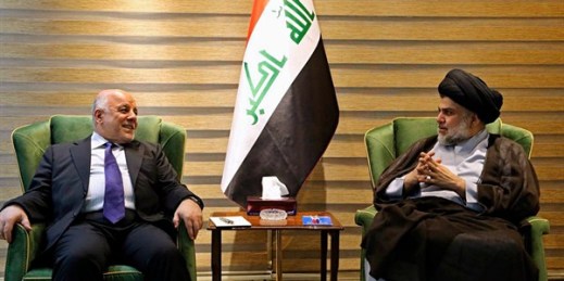 Iraqi Prime Minister Haider al-Abadi, left, and Shiite cleric Muqtada al-Sadr in the heavily fortified Green Zone in Baghdad, Iraq, May 20, 2018 (Iraqi government photo via AP).