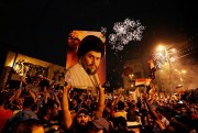 Supporters of Shiite cleric Muqtada al-Sadr celebrate in Tahrir Square, Baghdad, Iraq, May 14, 2018 (AP photo by Hadi Mizban).