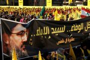 Supporters of Hezbollah leader Hassan Nasrallah hold a banner with his portrait during an election rally, Beirut, Lebanon, April 13, 2018 (AP photo by Hussein Malla).