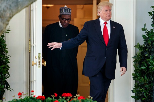 President Donald Trump and Nigerian President Muhammadu Buhari walk from the Oval Office to the Rose Garden of the White House for a news conference, April 30, 2018 (AP photo by Carolyn Kaster).
