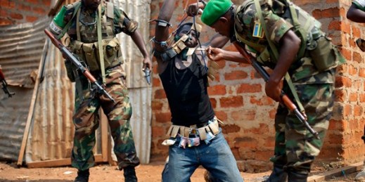 African Union peacekeepers detain a suspected anti-Balaka militia member, Bangui, Central African Republic, Jan. 22, 2014 (AP photo by Jerome Delay).