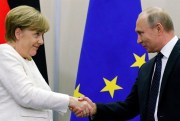 Russian President Vladimir Putin and German Chancellor Angela Merkel shake hands after a news conference at Putin’s residence in Sochi, Russia, May 18, 2018 (AP photo by Alexander Zemlianichenko).