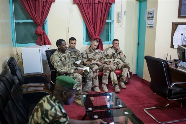 American and French soldiers attend a daily briefing with the Nigerien military commander in charge of the fight against Boko Haram at a Nigerien military base in Diffa, Niger, March 26, 2015 (photo by Joe Penney).