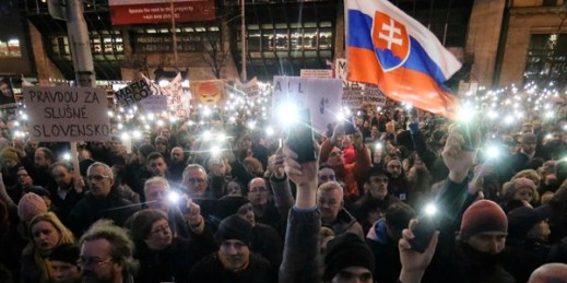 Demonstrators light the torches of their smartphones during an anti-government rally, Bratislava, Slovakia, April 15, 2018 (AP photo by Ronald Zak).
