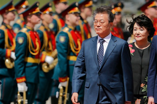 South Korean President Moon Jae-in and his wife, Kim Jung-sook, review an honor guard, Moscow, Russia, June 21, 2018 (AP photo by Alexander Zemlianichenko).