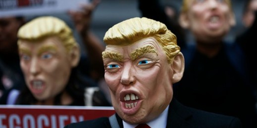 Activists wearing Donald Trump masks protest during NAFTA talks, Mexico City, Feb. 27, 2018 (AP photo by Marco Ugarte).