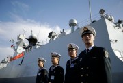 Chinese naval officials stand in front of the ship Daqing, San Diego, Calif., Dec. 7, 2016 (AP photo by Gregory Bull).