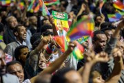 Ethiopians wave during the visit of Eritrean President Isaias Afwerki, Addis Ababa, Ethiopia, July 15, 2018 (AP photo by Mulugeta Ayene).