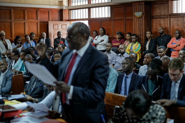 Members of the public listen as the High Court in Kenya begins hearing arguments in a case challenging parts of the penal code that target LGBT people, Nairobi, Kenya, Feb. 22, 2018 (AP photo by Ben Curtis).