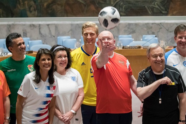 Ambassadors to the U.N. including Nikki Haley of the U.S. and Vassily Nebenzia of Russia and Secretary-General Antonio Guterres pose for a World Cup-themed photo, U.N. headquarters, New York, June 14, 2018 (AP photo by Mary Altaffer).