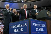 President Donald Trump shares the stage with Pete Stauber, right, a Republican congressional candidate, and House Majority Leader Kevin McCarthy, left, during a rally in Duluth, Minn., June 20, 2018 (AP photo by Susan Walsh).