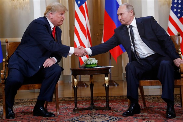 U.S. President Donald Trump and Russian President Vladimir Putin shake hands at the beginning of a meeting at the Presidential Palace in Helsinki, Finland, July 16, 2018 (AP photo by Pablo Martinez Monsivais).