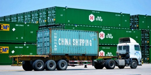 A truck moves a container from China Shipping at a port in Qingdao in eastern China’s Shandong province, July 6, 2018 (ChinaTopix photo via AP Images).
