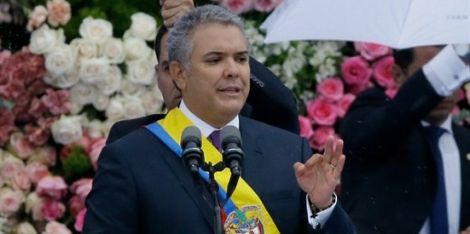 Wearing the presidential sash, Colombian President Ivan Duque speaks during his inauguration ceremony, Bogota, Aug. 7, 2018 (AP photo by Fernando Vergara).